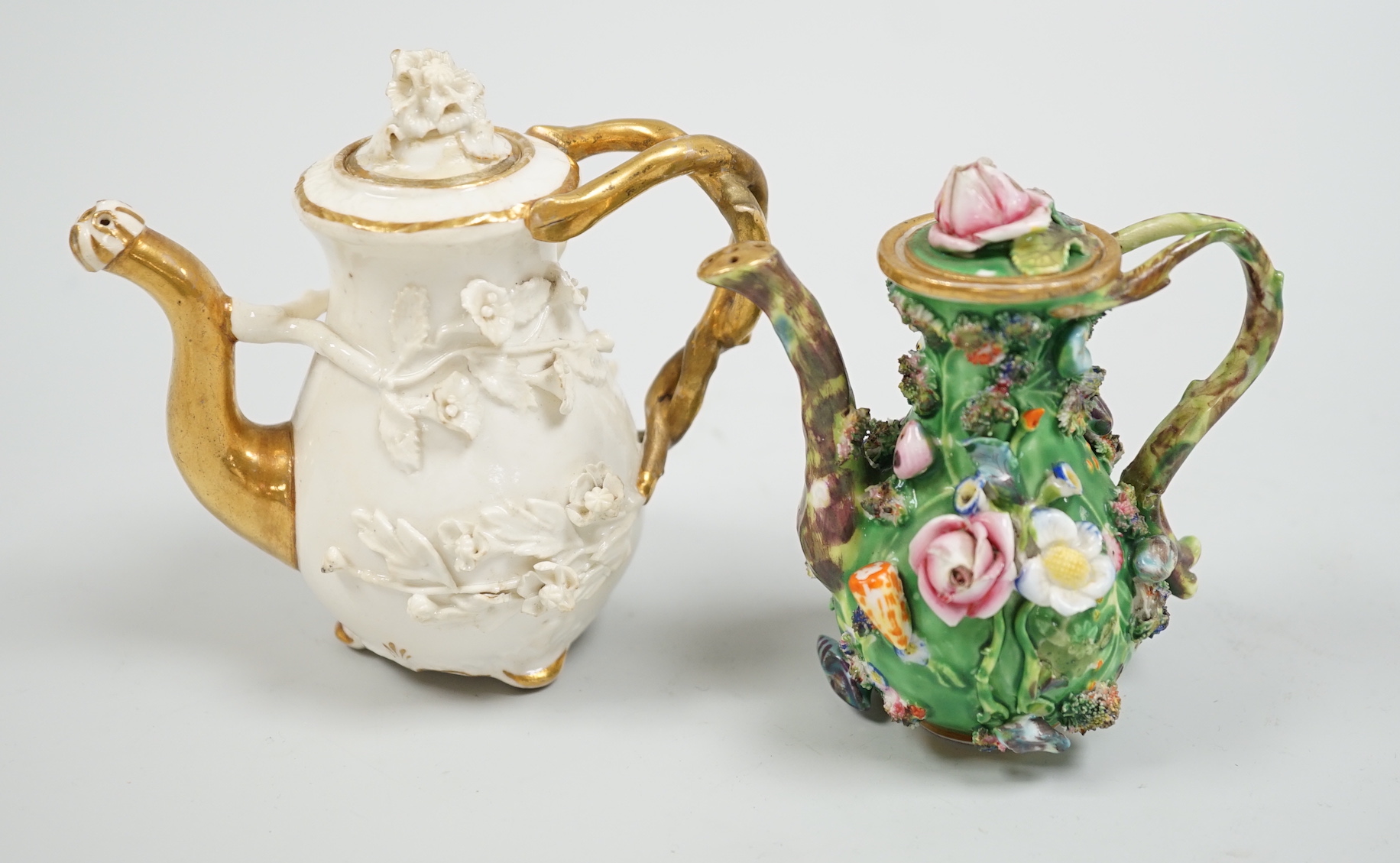 Toy porcelain. A Rockingham flower encrusted rosewater sprinkler and an English porcelain flower encrusted rosewater sprinkler, probably Spode, c.1830, the former with gilt model no. ‘C1’, tallest 10.5cm high